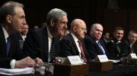 National Counterterrorism Center Director Matthew Olsen, FBI Director Robert Mueller, Director of National Intelligence James Clapper, and CIA Director John Brennan, Defense Intelligence Agency Director Lt. Gen. Michael Flynn, and Assistant Secretary of State for Intelligence and Research Philip Goldberg testify during a hearing before the Senate (Select) Intelligence Committee March 12, 2013 on Capitol Hill in Washington, DC. The committee held a hearing on 'Current and Projected National Security Threats to the United States.'