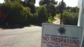 
Behind these trees on the left is the home containing explosive compounds. The Escondido home is set to be burned Thursday morning