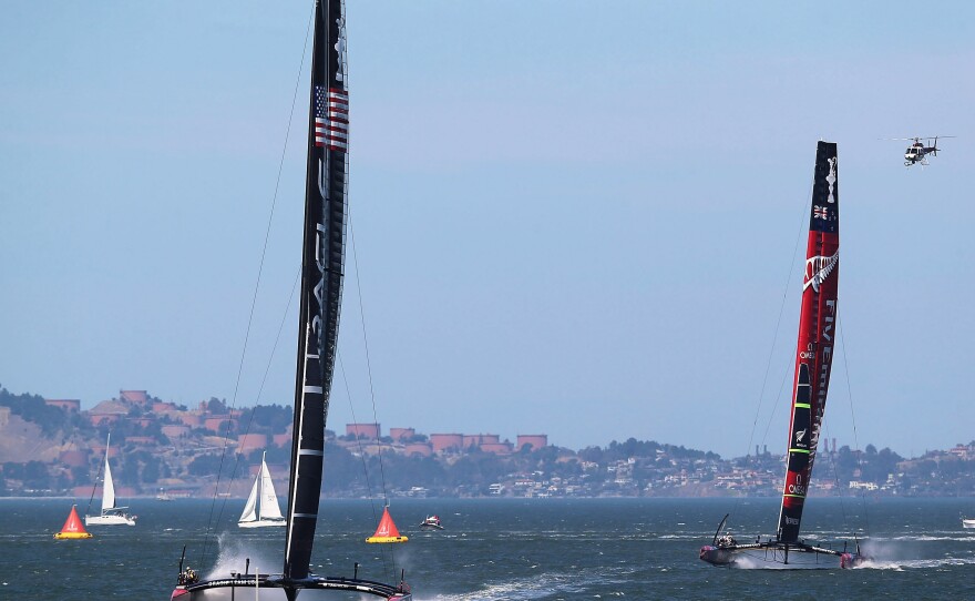 Oracle Team USA, skippered by James Spithill, sails ahead of Emirates Team New Zealand in the penultimate Race 17 on Tuesday.