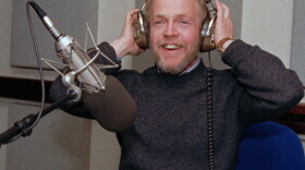 Noah Adams adjusts his headphones in the National Public Radio studio in Washington Feb.16, 1987.