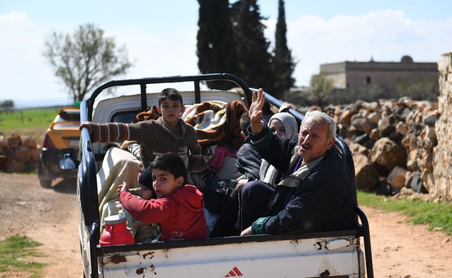 Civilans flee Afrin, a Syrian border city under siege by the Turkish military and its allies. The Turks embarked on an operation nearly two months ago to expel Kurdish fighters from the region, despite the Kurds' varying degrees of support from the U.S. and the Syrian government.