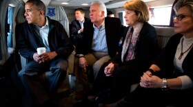 Aboard Marine One, President Barack Obama looks out over the central valley of California with Rep. Jim Costa and Senators Dianne Feinstein and Barbara Boxer as they fly to an event in Firebaugh, Calif., Feb. 14, 2014. 