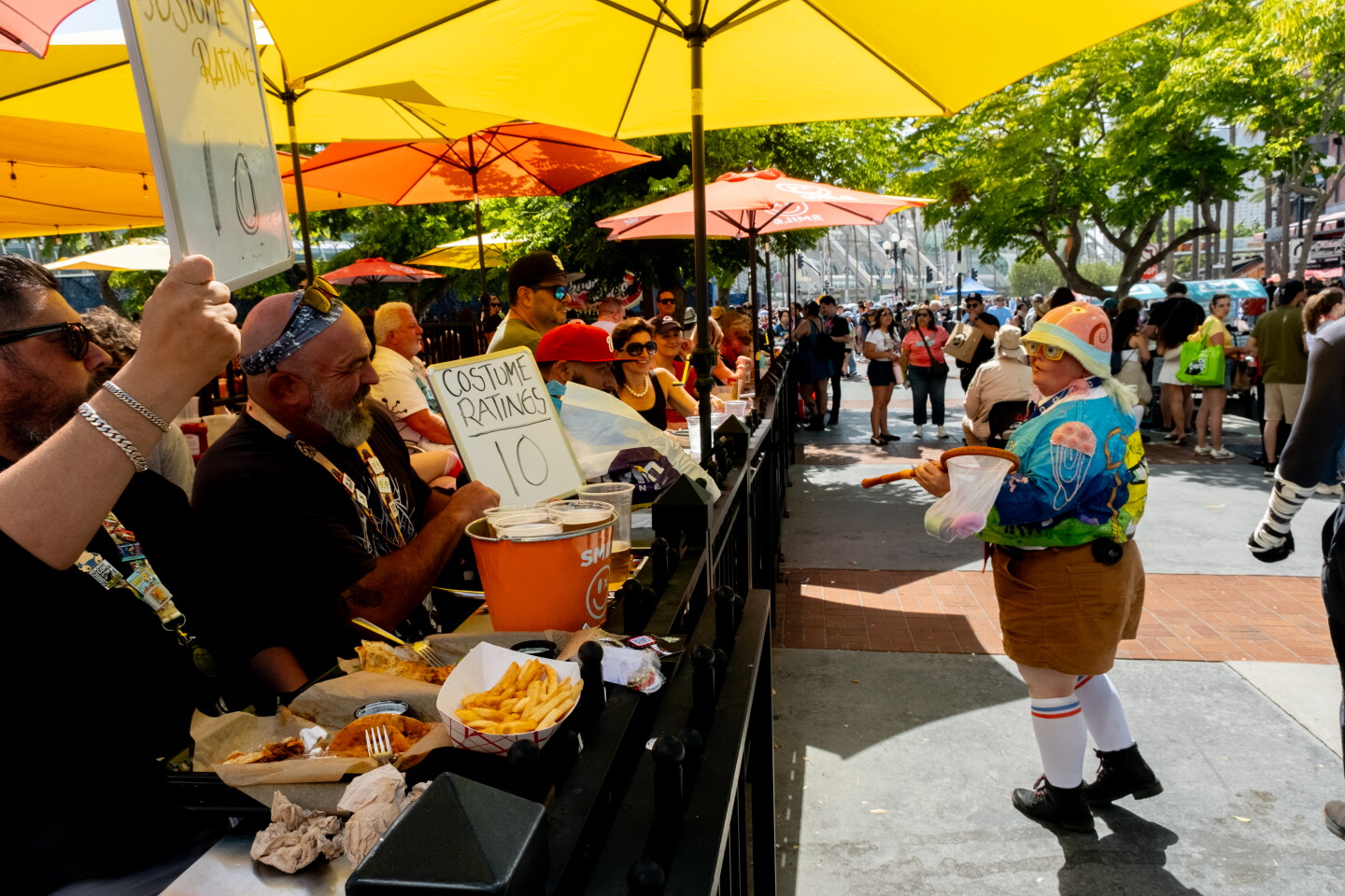 Austin Bara and Rudy Sanchez rate Comic-Con costumes on the street at Baja Rick's Cantina in Gaslamp, San Diego, July 24, 2026.