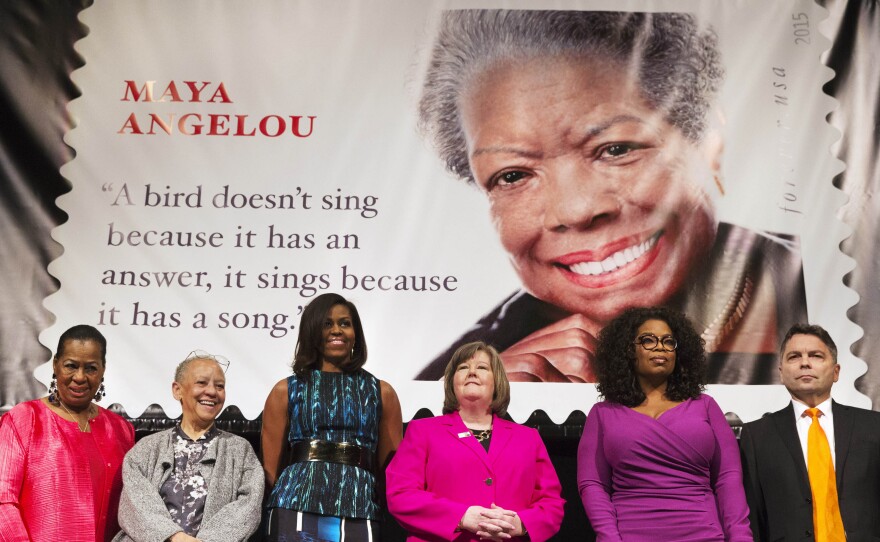 First lady Michelle Obama and Oprah Winfrey, among other distinguished presenters, attend the unveiling of the Maya Angelou Forever Stamp on Tuesday.