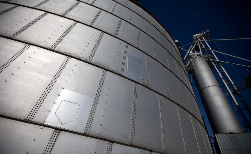 The home-plate shaped patches repaired cuts in the structure that were made during the 2010 rescue efforts. The cuts with special saws were required to drain thousands of bushels of corn.