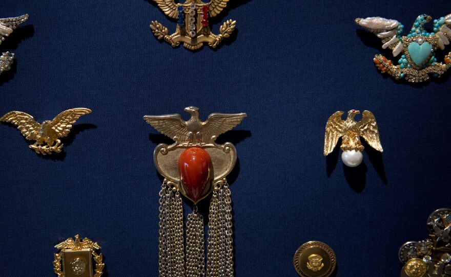 A view of pins and broaches worn by former Secretary Albright, are seen at the Mint Museum September 3, 2012 in Charlotte, North Carolina.