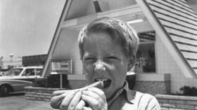 Wienerschnitzel celebrates its 50th anniversary this year.  In this photo, a young boy eats a hot dog in front of the first Der Wienerschnitzel restaurant in the 1960s.  When the restaurant opened its first cart in 1961, hot dogs cost 15 cents.