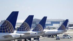 In this July 18, 2018, file photo, United Airlines commercial jets sit at a gate at Terminal C of Newark Liberty International Airport in Newark, N.J.