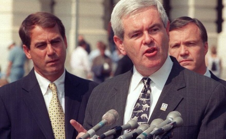 Then-House Speaker Newt Gingrich at a 1998 Capitol Hill news conference, flanked by Ohio Republican Rep. John Boehner, left (the current House speaker), and California Republican Rep. Christopher Cox.