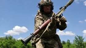 In this photo provided by Ukraine's 65th Mechanized Brigade press service, a soldier practices military skills at a training ground near the frontline in the Zaporizhzhia region, Ukraine, Saturday, June 20, 2026.