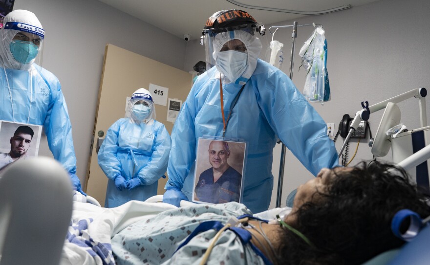 Medical staff members checked on a patient in the COVID-19 Intensive Care Unit at United Memorial Medical Center in Houston last November. Doctors are now investigating if people with lingering cognitive symptoms may be at risk for dementia.