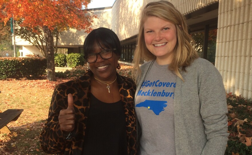 Darlene Hawes (left) and her enrollment counselor, Julieanne Taylor, outside the Mecklenburg County Health Department in Charlotte, N.C.