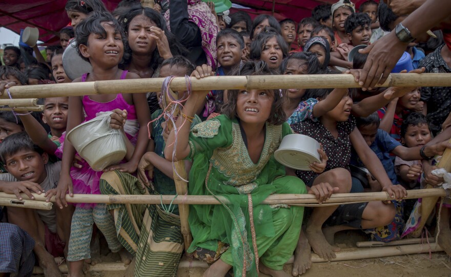 Rohingya Muslim children, who crossed over from Myanmar into Bangladesh, wait squashed against each other to receive food handouts distributed to children and women by a Turkish aid agency at Thaingkhali refugee camp, Bangladesh, in October.