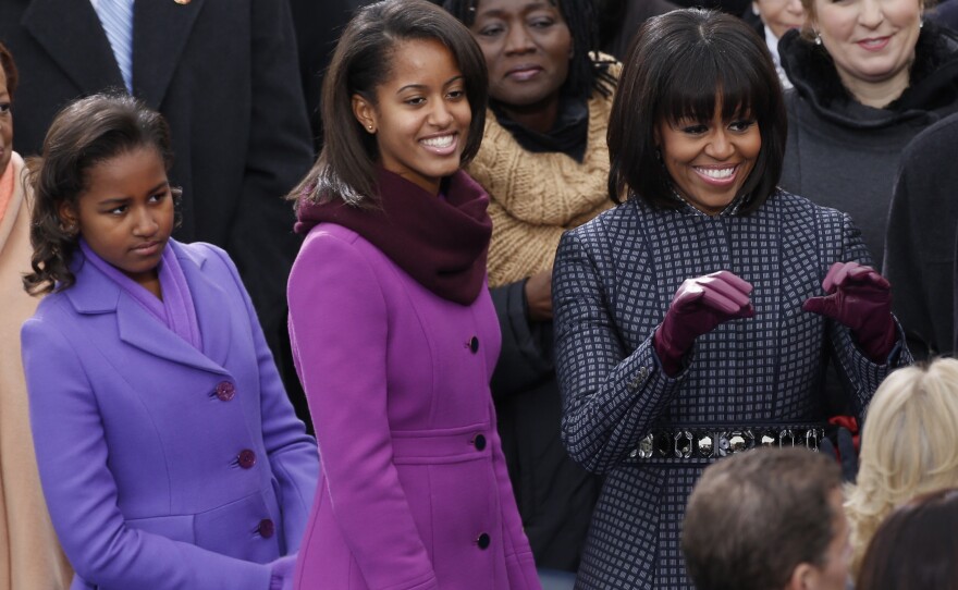 First lady Michelle Obama and her daughters Malia (center) and Sasha arrive for the swearing-in of President Obama at the Capitol.