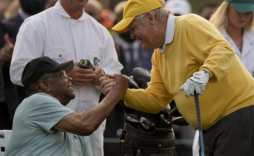 Jack Nicklaus shakes hands with Lee Elder after hitting the ceremonial first tee during the first round of the Masters golf tournament on April 8 in Augusta, Ga.