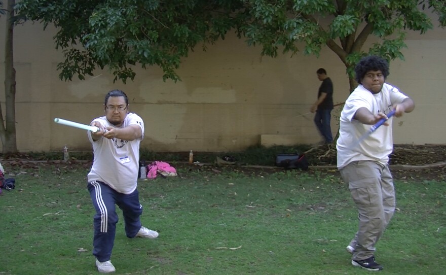 John-Michael Arias (left) founded Light Saber Team, which allows geeks to have a Jedi workout.