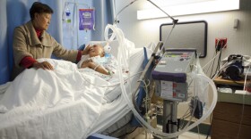 Paulina Burlaza visits her husband, Pepito, in a nursing home in El Cajon. Pepito lived at the nursing home 10 years in a vegetative state before dying of cardiac arrest in April 2014.