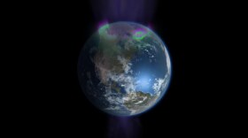 Visualization showing how charged particles stream onto the poles of the Earth creating the northern and southern lights.