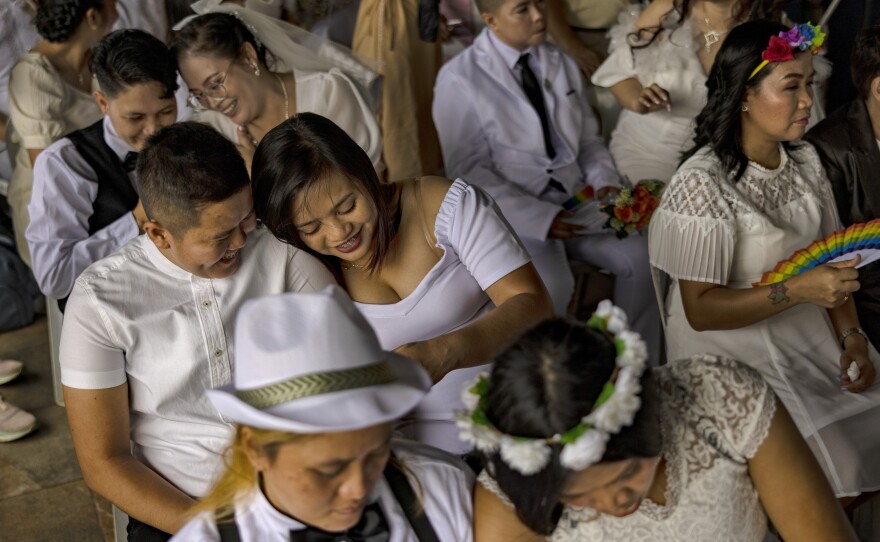 Filipino same-sex couples tie the knot in a mass wedding ceremony on June 25, 2023, in Quezon City in metro Manila, Philippines. In a symbolic act against the lack of comprehensive legislation for gender minorities in the Philippines, 29 same-sex couples tied the knot in a mass wedding ceremony organized by the LGBTS (Let God Be Thy Savior) Christian Church Inc.