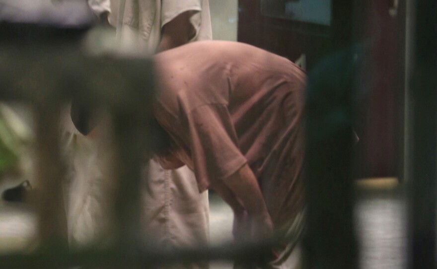 Cooperative captives conduct afternoon prayers inside a communal cellblock at Camp 6 last month at the U.S. Navy base at Guantanamo Bay, Cuba. Six long-time detainees of the prison have been transferred to Uruguay.