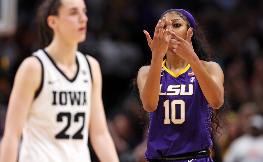 Angel Reese of the LSU Tigers gestures towards Caitlin Clark of the Iowa Hawkeyes towards the end of the NCAA Women's Basketball Tournament championship game in Dallas on Sunday.