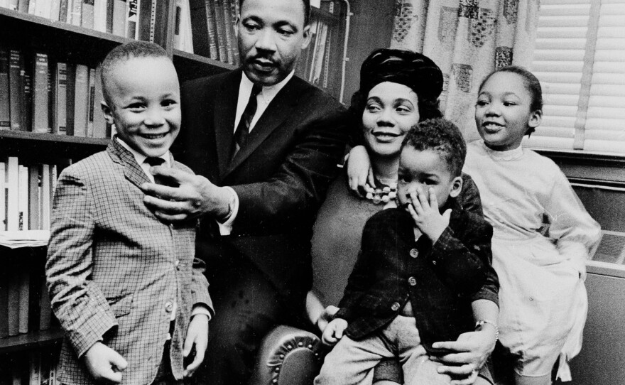 Dr. Martin Luther King Jr. and his wife, Coretta Scott King, sit with three of their four children in their Atlanta, Ga., home in 1963. From left are: Martin Luther King III, 5, Dexter Scott, 2, and Yolanda Denise, 7.