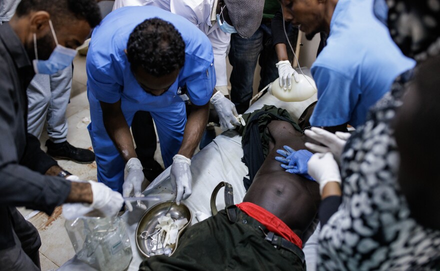 Doctors attempt to resuscitate a victim of shelling at the Al-Nao Hospital in Omdurman, Sudan, on Sept. 5. The victim was later announced dead.