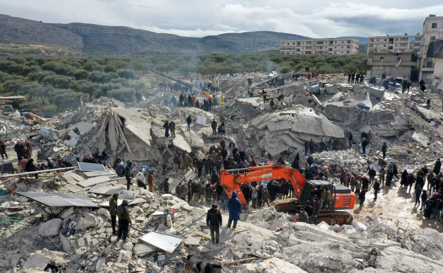 Residents and rescue teams searching for survivors in the rubble of collapsed buildings in the aftermath of Monday's earthquake.