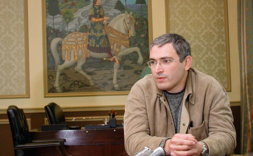 Mikhail Khodorkovsky, then the CEO of the Russian oil company Yukos, poses for photographs in his private office in 2003.