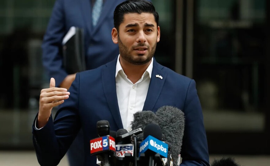 Congressional candidate Ammar Campa-Najjar speaks in front of a federal court in San Diego on Dec. 3, 2019.
