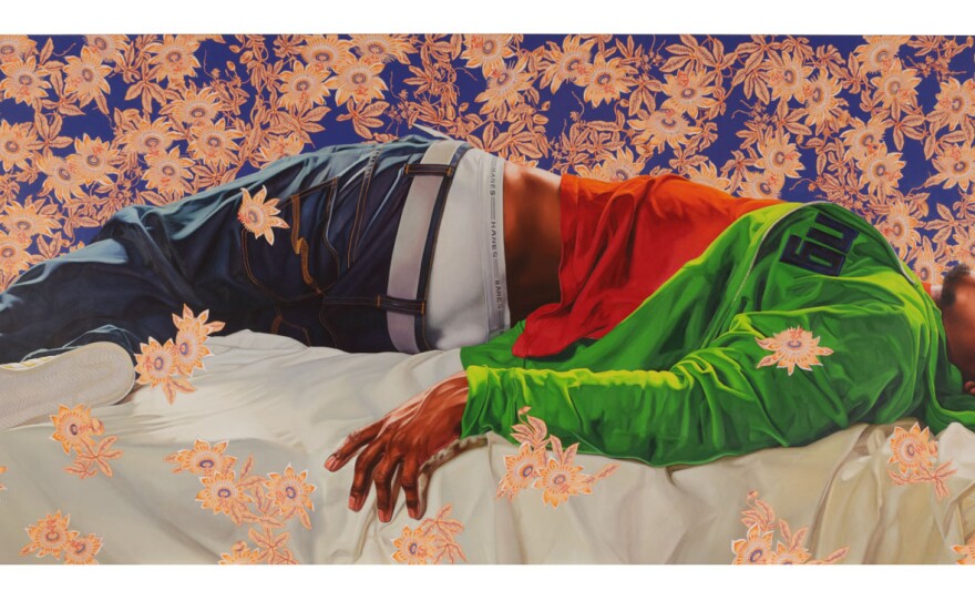 Kehinde Wiley's colossal portrait of a young man,<em> Femme piquée par un serpent,</em> stretches across one wall of the gallery.