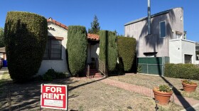 A "for rent" sign is seen in the front yard of a home in University Heights, Oct. 24, 2025.