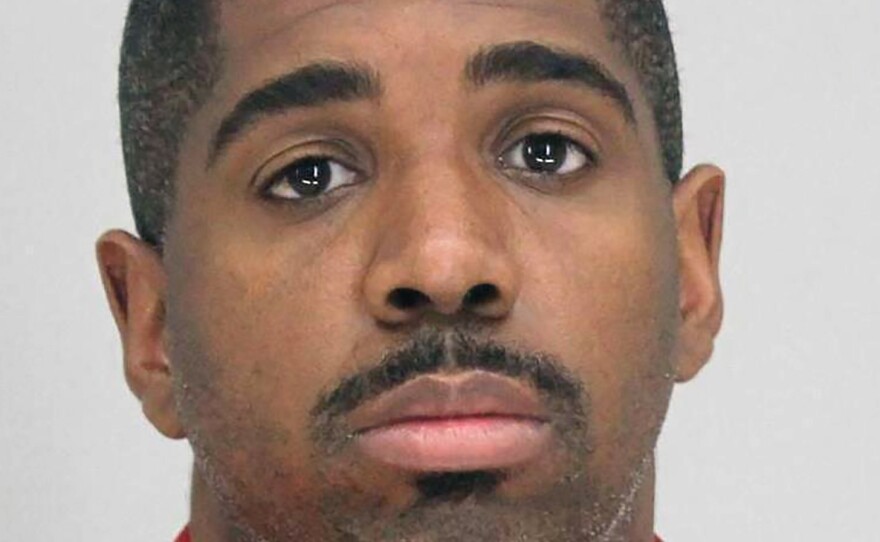 A photo provided by the Dallas County Sheriff's Office shows Bryan Riser. Authorities say Riser, a Dallas police officer, has been arrested on two counts of capital murder, more than a year and a half after a man told investigators that he kidnapped and killed two people at the officer's instruction in 2017.