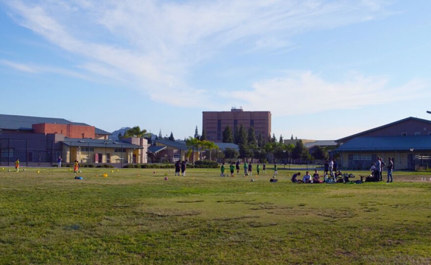 Kids playing on the soccer field. Yalla, an after school program, uses soccer as the hook to prepare kids for college.