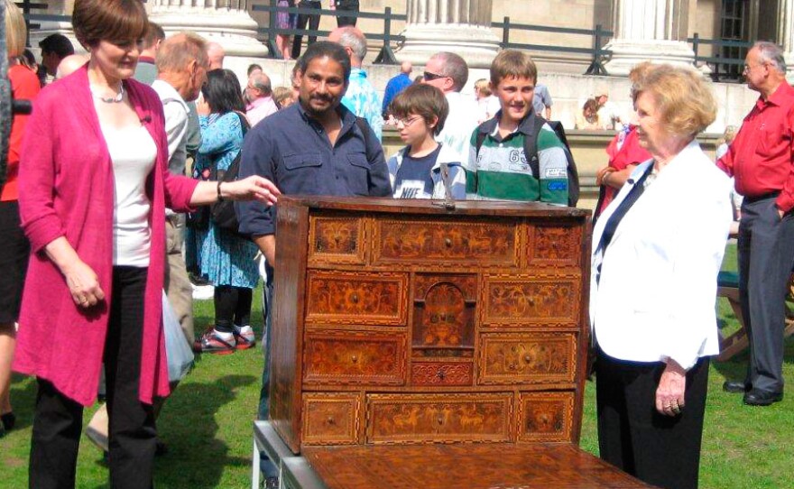 Deborah examines a 1580 Vargueño Cabinet.