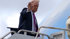 President Donald Trump waves as he boards Air Force One, Sunday, March 29, 2026, at Palm Beach International Airport in West Palm Beach, Fla.