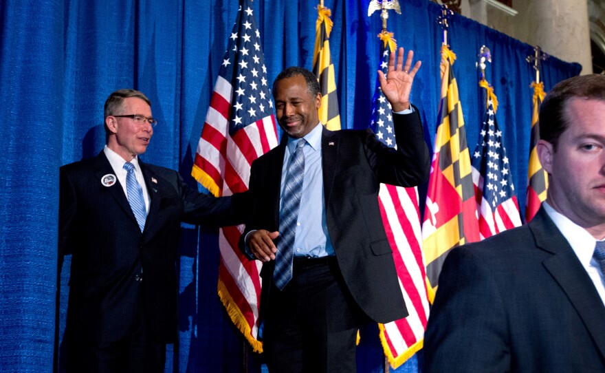 Republican presidential candidate Ben Carson waves to supporters during an election night party in Baltimore.