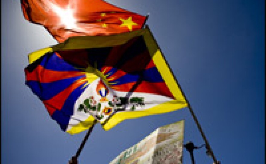 Thousands gathered in San Francisco on Wednesday to protest China's human rights record. Here the Chinese and Tibet flags clash as their respective supporters march through the city.