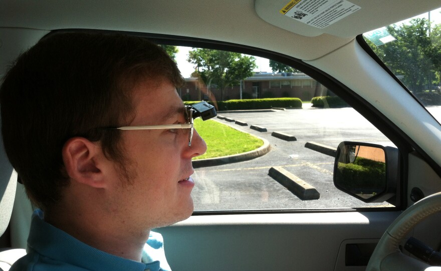 Wearing a bioptic telescope on his glasses, Dustin Jones, who is visually impaired, is able to drive.
