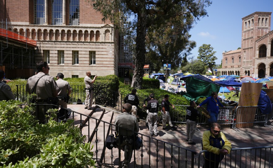 A law enforcement and security presence is seen on the UCLA campus, the morning after clashes between Pro-Israel and Pro-Palestinian groups, Wednesday, May 1, 2024, in Los Angeles. 