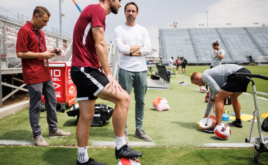 Sacramento Republic FC president and general manager Todd Dunivant talks to players after practice.