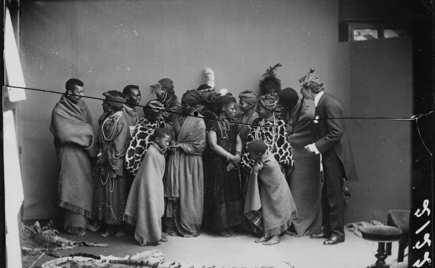 Members of The African Choir pose for a group portrait with their English musical director James Balmer (far right), 1891.