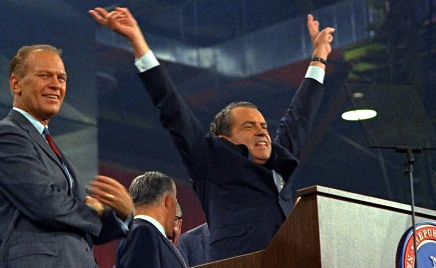 Republican presidential nominee Richard Nixon raises his arms in victory after accepting his party's nomination at the Republican Convention in Miami on Aug. 8, 1968.