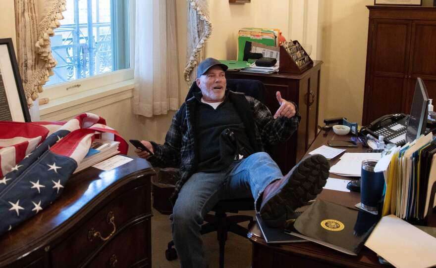 Richard Barnett has been arrested in his home state of Arkansas and faces charges related to his part in the forced entry into the Capitol. During the riot, Barnett sat in House Speaker Nancy Pelosi's office.