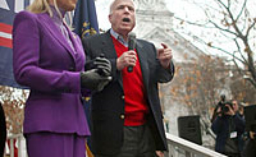 Sen. and presidential contender John McCain (R-AZ) speaks as his wife Cindy looks on at a 'The Mac is Back' rally in Keene, N.H. McCain is banking on a win in the state.