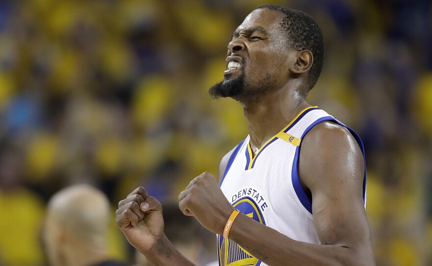 Golden State Warriors forward Kevin Durant reacts after scoring against the Cleveland Cavaliers on the way to the Warriors' second NBA title in three years.