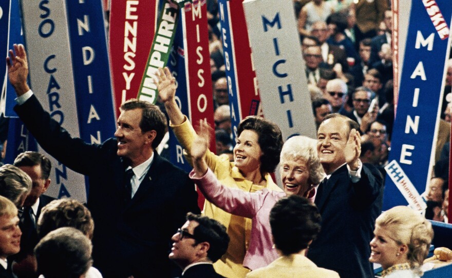 Vice President Hubert Humphrey (right) and his running mate, Sen. Edmund S. Muskie, wave to the crowd with their wives at the Democratic Convention in Chicago on Aug. 29, 1968. Violence ensued inside and outside the convention hall.