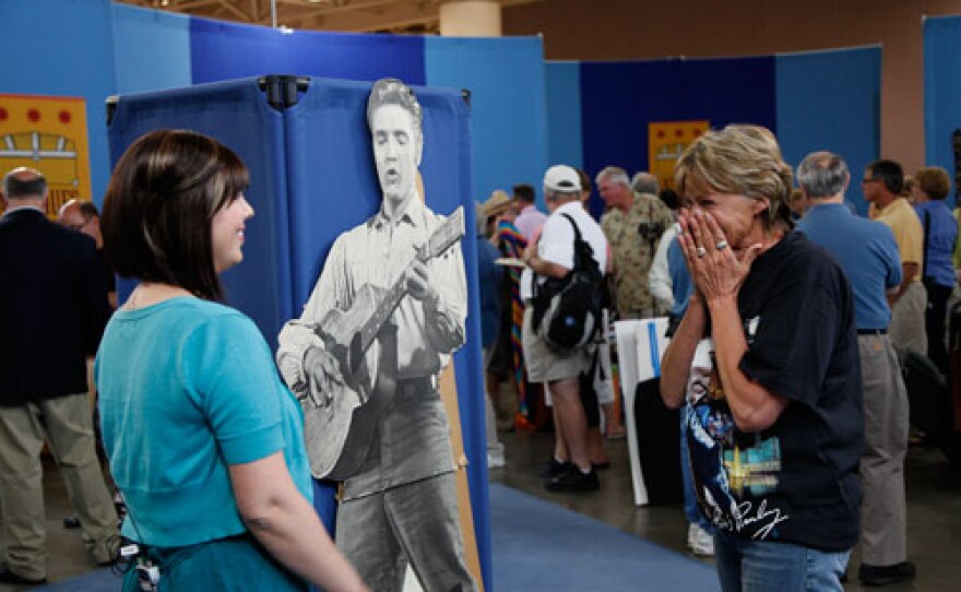 This 1956 Elvis "Love Me Tender" standee was appraised by Laura Woolley (right) for $10,000 to $15,000 in 2012. The updated value is $18,000 to $20,000.