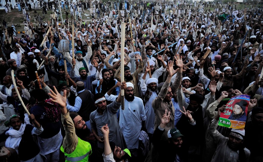 Pakistani religious protesters march in the capital Islamabad on Wednesday, where tens of thousands demonstrated this past week. Their demands included government assurances that the country's strict blasphemy laws would not be eased. The protesters agreed to leave after saying they had received such promises.