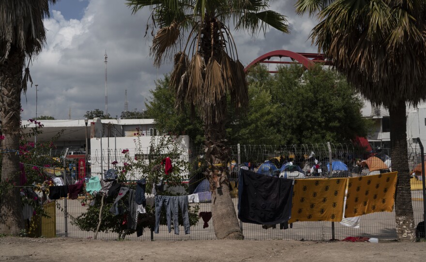 Drying migrants clothes in an encampment near the Gateway International Bridge in Matamoros, Tamaulipas. More than 1,500 asylum-seekers are living in the tent encampment.